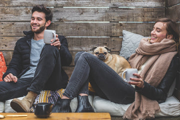 People having coffee with their dog